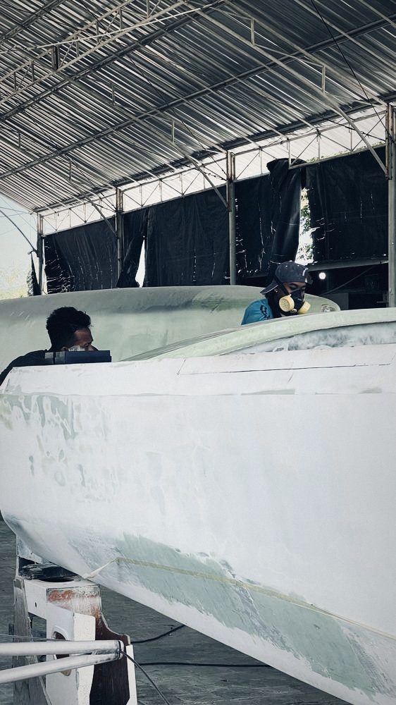Crew fairing a hull