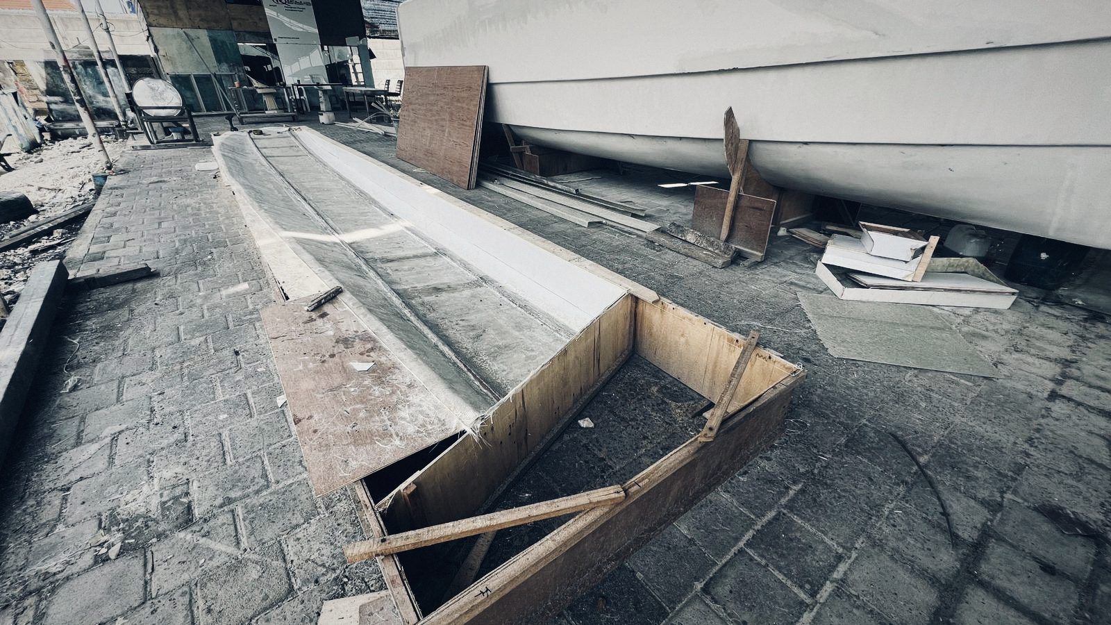 Mold on the floor beside a finished hull